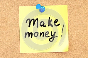 Make money! Text on a sticky note pinned to a corkboard. 3D rend