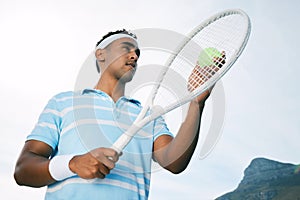 Make the most of today. a handsome young man getting ready to serve a ball during a tennis match.