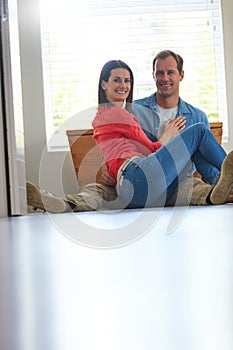 Make a point of spending quality time together. Portrait of a mature couple relaxing together at home.