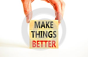 Make things better symbol. Concept words Make things better on wooden block on a beautiful white table white background.