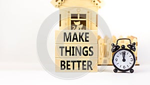 Make things better symbol. Concept words Make things better on wooden block on a beautiful white table white background. Black