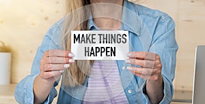 Make things happen, text words typography written on book against wooden background, life and business motivational inspirational