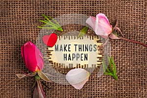 Make things happen written in hole on the burlap
