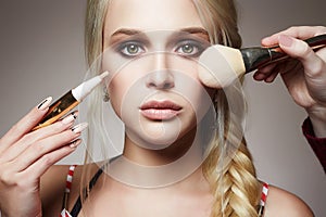 Make-up. apply cosmetics. model blonde girl