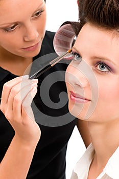 Make-up artist woman fashion model apply eyeshadow