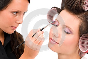 Make-up artist woman fashion model apply eyeshadow