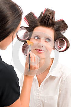 Make-up artist woman fashion model apply powder