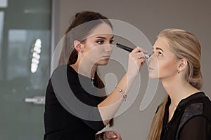 Make-up artist work in her studio