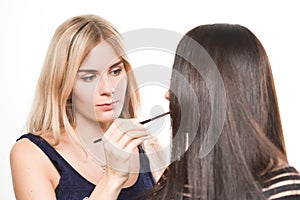 Make-up artist work in her studio.