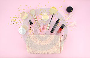 Make up bag and set of professional decorative cosmetics, makeup tools and accessory on pink background. beauty, fashion