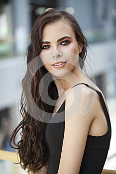 Make up beauty. Close up portrait young brunette woman in black dress