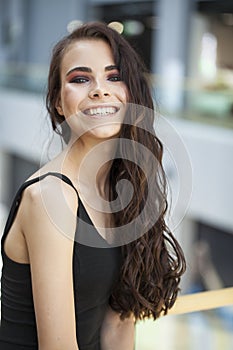 Make up beauty. Close up portrait young brunette woman in black dress