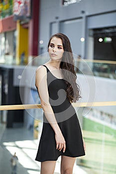 Make up beauty. Close up portrait young brunette woman in black dress