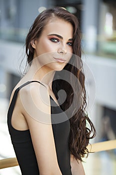 Make up beauty. Close up portrait young brunette woman in black dress