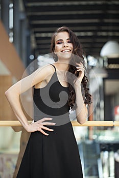 Make up beauty. Close up portrait young brunette woman in black dress