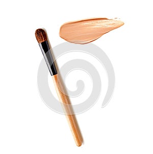 Make up brush with beige foundation cosmetic isolate