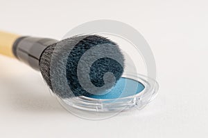 Make-up brush with blue eyeshadows