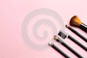 Make up brush on colorful background. Fashion model. Beauty, skincare. Black background. Makeup, cosmetics. Beauty woman