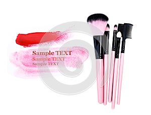 Make up brush isolate on white with paint pink for your text (sample text).