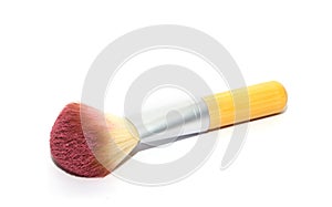 Make up brush with pink powder isolated on white