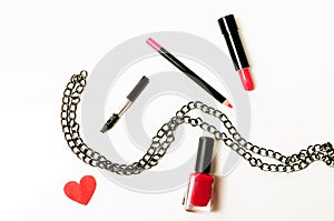 Make up cosmetic bag with professional accessories. Lipsticks and brushes in a black cosmetic bag in white background