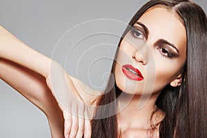 Make-up & cosmetics. Woman with healthy long hair