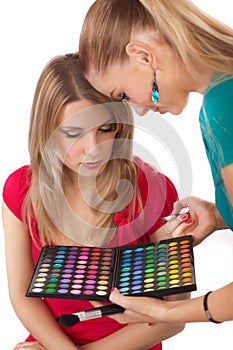 Make-up girl showing range of collors photo