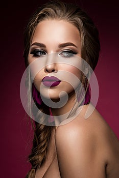 Make up. Glamour portrait of beautiful woman model with fresh makeup and romantic hairstyle.