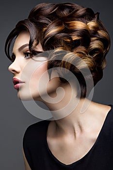 Make up. Glamour portrait of beautiful woman model with fresh makeup and romantic wavy hairstyle.