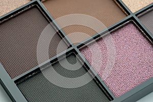 Make-up palette close up. Professional multicolor eye shadow make-up palette. Cosmetic products