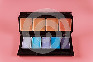 Make up palette, eye shadows in black box