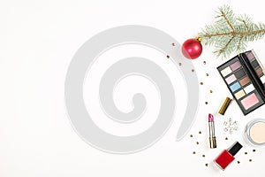 Make up cosmetic with Christmas decoration on white background flat lay