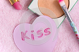 Make up products on a soft pink background, close up, daily objects