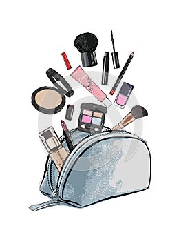 Make up products spilling out of a cosmetics bag and isolated on