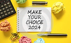 Make your choice 2024 symbol. Concept words Make your choice 2024 on beautiful white note. Beautiful yellow background. Calculator