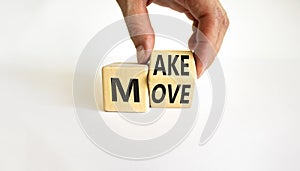 Make your move symbol. Businessman turns the wooden cube with words `Make move`. Beautiful white background. Make your move and