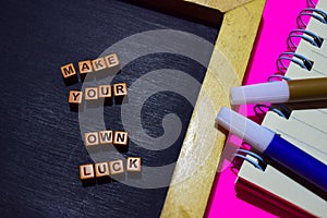 Make your own luck message written on wooden blocks. Motivation concepts. Cross processed image