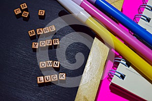 Make your own luck message written on wooden blocks. Motivation concepts. Cross processed image