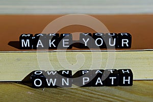 Make your own path on wooden blocks. Motivation and inspiration concept