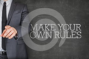 Make your own rules on blackboard with businessman