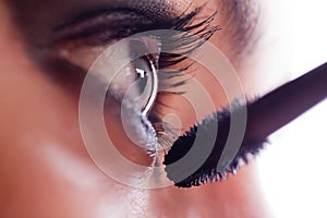 She makes-up eyelashes with mascara a special wand