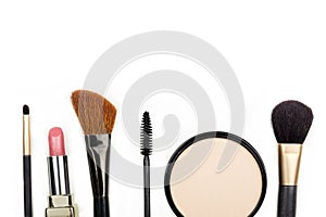 Makeup accessories, shot from above, with copy space on white