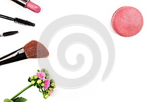 Makeup accessories, shot from above, with copy space on white