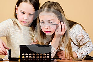 Makeup art. Explore moms cosmetics bag concept. Salon and beauty treatment. Children little girls make up face. Makeup