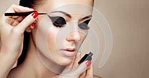 Makeup artist applies eyeshadow
