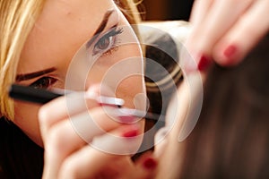 Makeup artist applying makeup