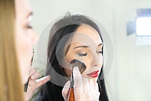 Makeup artist doing make up