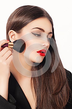 Makeup. Beauty Girl with Make up Brushes. Natural Make-up for Brunette Woman