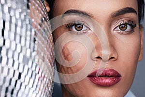 Makeup, beauty and portrait of woman with disco ball for red lips, face and skin routine. Cosmetics, model and headshot