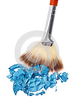 Makeup brush with blue crushed eye shadow